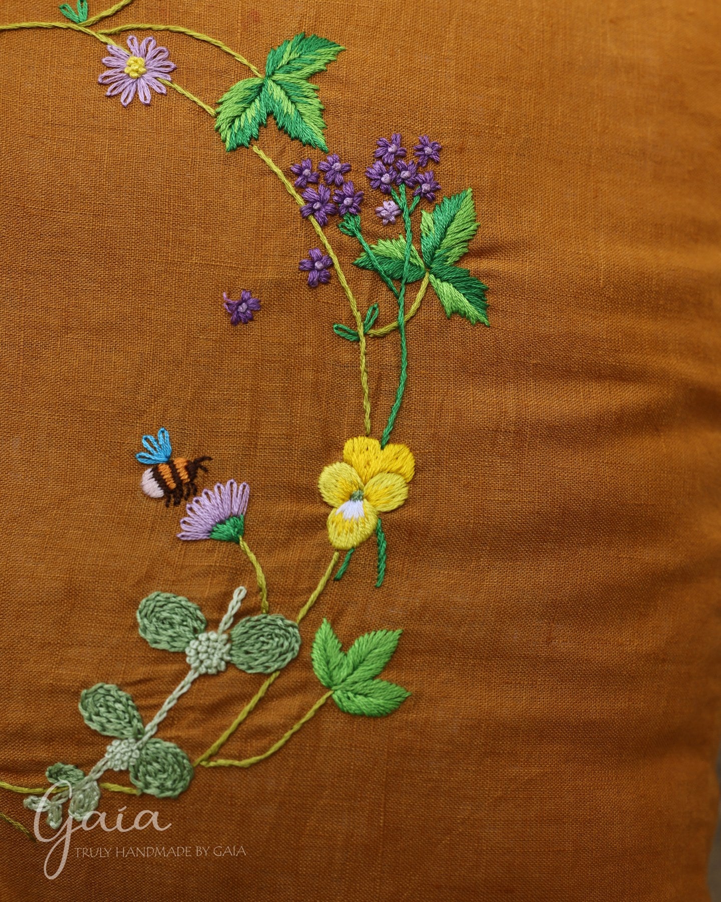 Hand-embroidered linen cushion cover