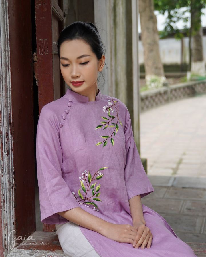 Linen Vietnamese dress culture with handmade embroidery