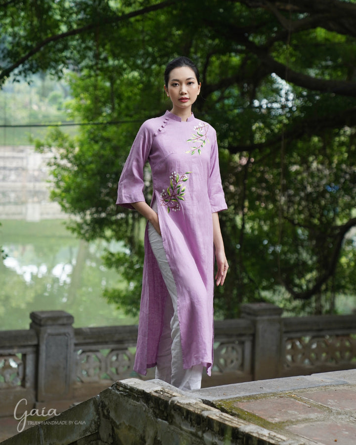 Linen Vietnamese dress culture with handmade embroidery