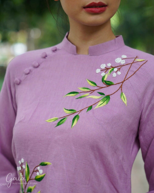 Linen Vietnamese dress culture with handmade embroidery