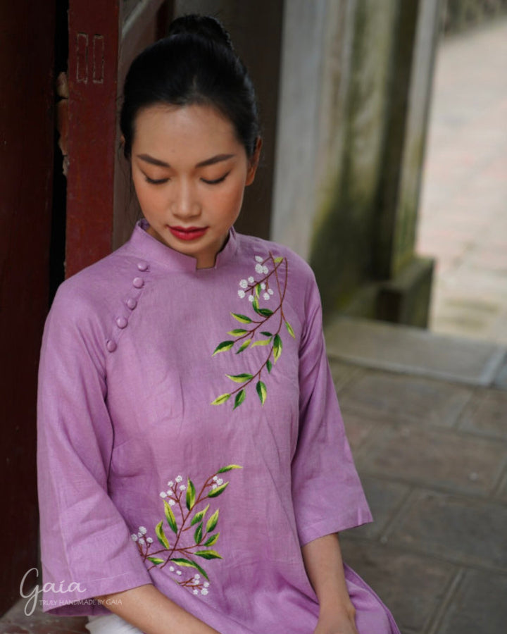 Linen Vietnamese dress culture with handmade embroidery