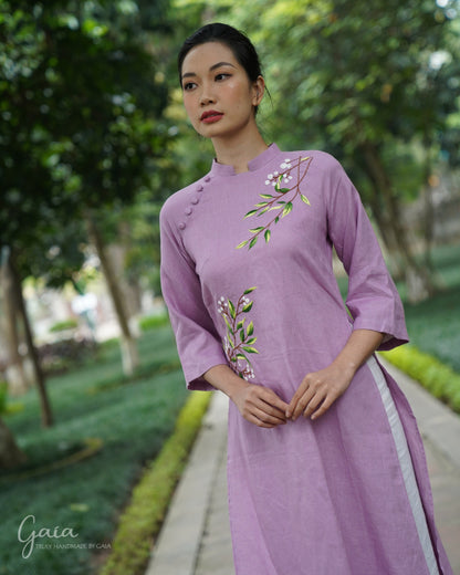 Linen Vietnamese dress culture with handmade embroidery